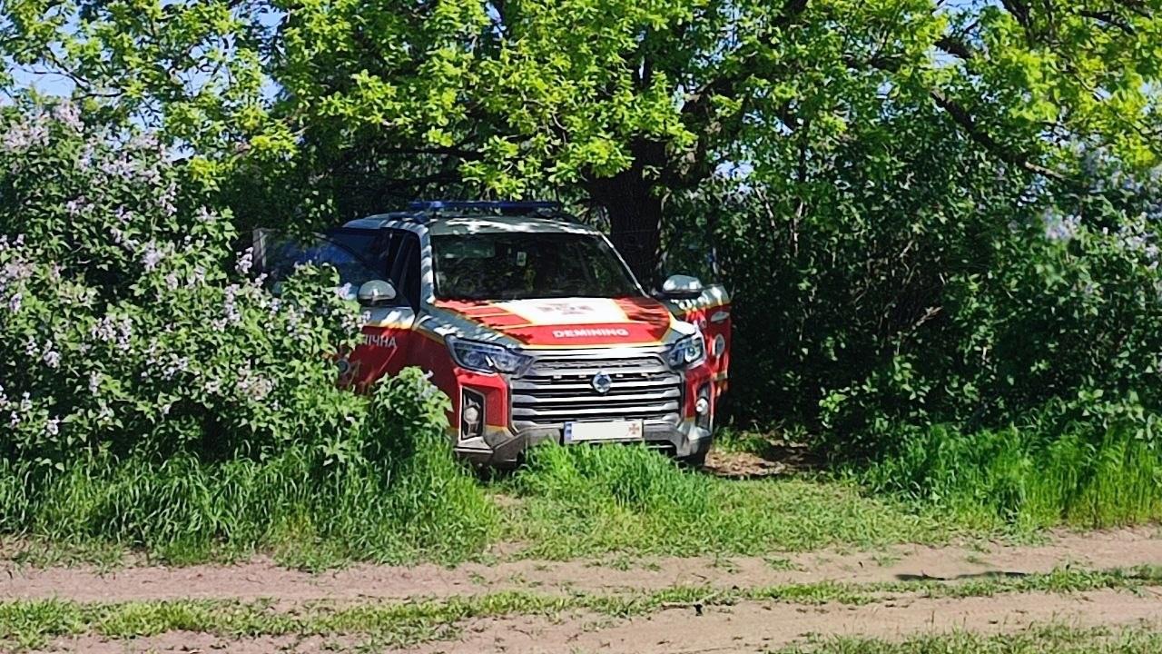 A State Emergency Service vehicle hidden under trees during demining work. Photo by the head of the State Emergency Service pyrotechnic unit.