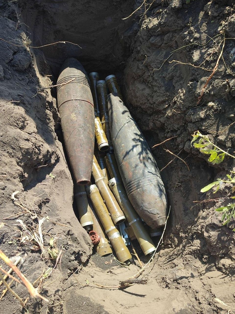 A pit with explosive objects before their destruction. Photo by the head of the State Emergency Service pyrotechnic unit.